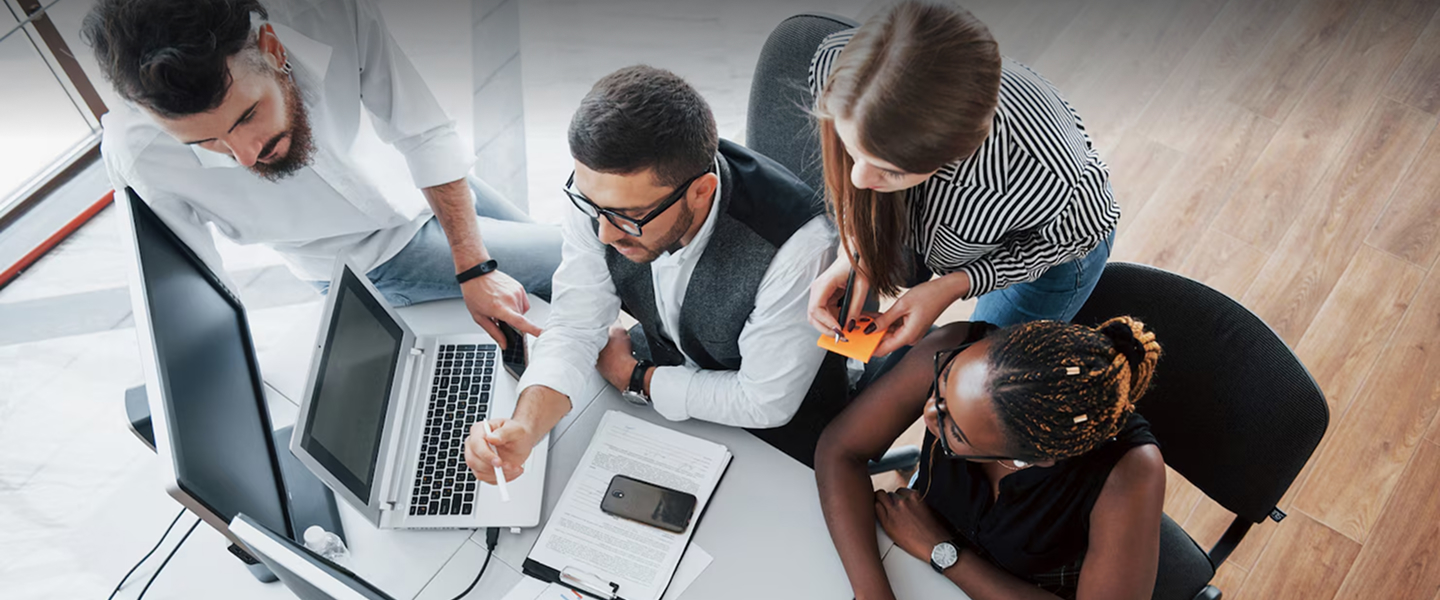 Team collaborating around a desk